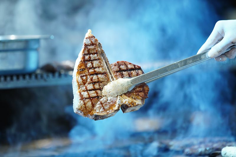 Freshly assembled tacos with colorful toppings on a wooden board